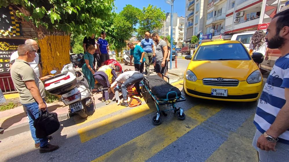 Efeler'de yolun karşısına geçmek isteyen kadına taksi çarptı: 1 yaralı